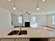 Modern kitchen with white cabinets, quartz countertops and island at 1814 Emory Ln # 92, Conyers, GA 30013