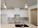 Modern kitchen with white cabinets, quartz countertops, and island at 1814 Emory Ln # 92, Conyers, GA 30013