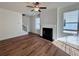 Bright living room featuring hardwood floors, fireplace, and large windows at 1814 Emory Ln # 92, Conyers, GA 30013