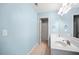 Light blue bathroom with double vanity and shower at 37 Waterstone Se Dr, Cartersville, GA 30121