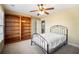 Bedroom with wood bookshelves and metal bed frame at 37 Waterstone Se Dr, Cartersville, GA 30121