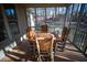 Relaxing screened porch with wooden table and chairs, overlooking backyard at 37 Waterstone Se Dr, Cartersville, GA 30121