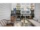 Cozy outdoor balcony with lounge seating, wicker chairs, and views of the surrounding architecture at 396 Pratt Se Dr # 1932, Atlanta, GA 30315