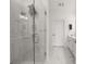 Modern bathroom featuring a glass-enclosed shower with sleek fixtures and elegant white marble-look tiles at 396 Pratt Se Dr # 1932, Atlanta, GA 30315
