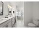 Stylish bathroom featuring double sinks, modern vanity, shower, and toilet at 396 Pratt Se Dr # 1932, Atlanta, GA 30315