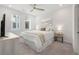 Bright bedroom with ceiling fan, comfortable bed, and a view from the windows at 396 Pratt Se Dr # 1932, Atlanta, GA 30315