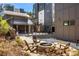 Outdoor fire pit area with Adirondack chairs in a complex with building pavilion and built-in grilling station at 396 Pratt Se Dr # 1932, Atlanta, GA 30315