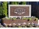 A community sign surrounded by flowers, indicating a welcoming and well-maintained neighborhood at 396 Pratt Se Dr # 1932, Atlanta, GA 30315