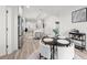 Open-concept dining area adjacent to a modern kitchen, featuring a stylish table and seating, ideal for everyday meals at 396 Pratt Se Dr # 1932, Atlanta, GA 30315