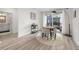 Cozy dining area with a round table, seating for four, and sliding glass doors to the outside balcony at 396 Pratt Se Dr # 1932, Atlanta, GA 30315