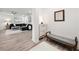 Inviting entryway with modern decor, a comfortable bench, and a view into the spacious living room at 396 Pratt Se Dr # 1932, Atlanta, GA 30315