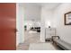 Inviting entryway with storage bench and coat closet leads to a spacious living area, with light colored flooring at 396 Pratt Se Dr # 1932, Atlanta, GA 30315