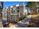 View of modern apartment buildings featuring balconies and walkways located next to a sidewalk at 396 Pratt Se Dr # 1932, Atlanta, GA 30315