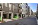 A row of modern townhomes, each with its own garage and balcony, lines a neighborhood street at 396 Pratt Se Dr # 1932, Atlanta, GA 30315