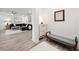 Entrance foyer featuring shoe cabinet, bench, and view into a stylishly furnished living area at 396 Pratt Se Dr # 1932, Atlanta, GA 30315