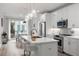 Well-equipped kitchen with sleek white cabinetry, modern appliances, and an island with barstool seating at 396 Pratt Se Dr # 1932, Atlanta, GA 30315