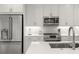 Bright, modern kitchen with stainless appliances, white cabinets, and clean lines for a sleek and functional design at 396 Pratt Se Dr # 1932, Atlanta, GA 30315