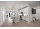 Contemporary kitchen featuring stainless steel appliances, white cabinets, and a view of the dining area at 396 Pratt Se Dr # 1932, Atlanta, GA 30315