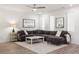 Spacious living room featuring a large sectional sofa and hardwood floors at 396 Pratt Se Dr # 1932, Atlanta, GA 30315