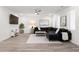 Spacious living room with modern furnishings, including a large sectional sofa, plush rug, and flat-screen TV at 396 Pratt Se Dr # 1932, Atlanta, GA 30315