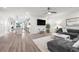 Inviting living room with seamless flow to the kitchen, featuring a comfortable gray sectional and modern finishes at 396 Pratt Se Dr # 1932, Atlanta, GA 30315