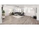 Open-concept living room boasts a spacious layout, gray sectional, and modern furnishings for a comfortable atmosphere at 396 Pratt Se Dr # 1932, Atlanta, GA 30315