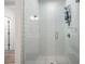 Glass shower stall featuring white subway tile and chrome fixtures, creating a spa-like experience at 396 Pratt Se Dr # 1932, Atlanta, GA 30315