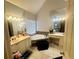 Bathroom with a large soaking tub, dual vanity, and bright natural light at 232 Spalding Drive Dr, Atlanta, GA 30328