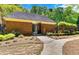 Brick community building with gated entrance and landscaped walkway at 232 Spalding Drive Dr, Atlanta, GA 30328