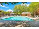 A community pool provides a refreshing escape, surrounded by lounge chairs and lush landscaping for ultimate relaxation at 232 Spalding Drive Dr, Atlanta, GA 30328