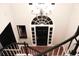 Elegant entryway with black railings and a chandelier at 232 Spalding Drive Dr, Atlanta, GA 30328