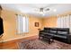 Bright living room featuring hardwood floors and a comfy leather sofa at 3880 Admiral Dr, Atlanta, GA 30341