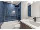 Modern bathroom with blue tile and floating vanity at 126 Marona Ne St, Atlanta, GA 30307