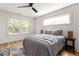 Bright bedroom with hardwood floors, large windows, and ceiling fan at 126 Marona Ne St, Atlanta, GA 30307