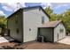 Gray house with dark trim, detached garage, and a well maintained yard at 126 Marona Ne St, Atlanta, GA 30307