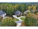 Brick home with a large yard and circular driveway, seen from above at 2214 Taylor Grady Ter, Duluth, GA 30097