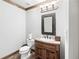 Basement bathroom with vanity, decorative mirror, and tile flooring at 2214 Taylor Grady Ter, Duluth, GA 30097