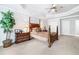 Large basement bedroom with a post bed, dresser, and ceiling fan at 2214 Taylor Grady Ter, Duluth, GA 30097