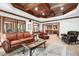 Comfortable basement rec room with leather furniture, high ceilings and views into bar area at 2214 Taylor Grady Ter, Duluth, GA 30097