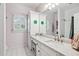 Neat bathroom with granite countertop, white cabinets, and tiled floor at 2214 Taylor Grady Ter, Duluth, GA 30097