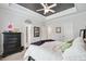 Spacious bedroom with a coffered ceiling and carpet flooring at 2214 Taylor Grady Ter, Duluth, GA 30097