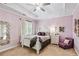 Charming bedroom with a white bed, soft purple walls and carpeted floor at 2214 Taylor Grady Ter, Duluth, GA 30097