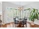 Bright dining room with round table, four chairs, and access to backyard at 2214 Taylor Grady Ter, Duluth, GA 30097