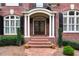 Elegant front entrance with brick steps, columns, and double doors at 2214 Taylor Grady Ter, Duluth, GA 30097