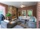 Cozy brick patio with seating area and fireplace at 2214 Taylor Grady Ter, Duluth, GA 30097