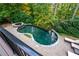 Inviting kidney-shaped pool with spa and stonework at 2214 Taylor Grady Ter, Duluth, GA 30097