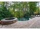 Luxury pool with spa and waterfall feature at 2214 Taylor Grady Ter, Duluth, GA 30097