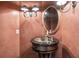 Elegant powder room with pedestal sink and decorative wall finish at 2214 Taylor Grady Ter, Duluth, GA 30097