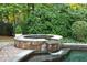 Stone spa with a waterfall feature at 2214 Taylor Grady Ter, Duluth, GA 30097