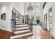 Grand staircase with wrought iron railing and hardwood floors at 2214 Taylor Grady Ter, Duluth, GA 30097